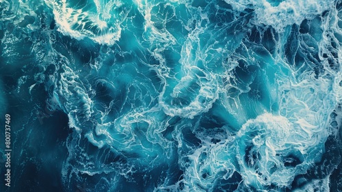 Aerial view of turbulent ocean waves with foam