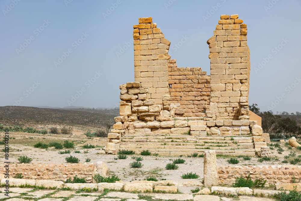 View of unknown temple with ruined stone walls in archeological site of Sufetula, Tunisia