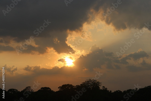 Sunset sky clouds in the Evening with Golden orange sunlight in golden hour  Dusk sky background.