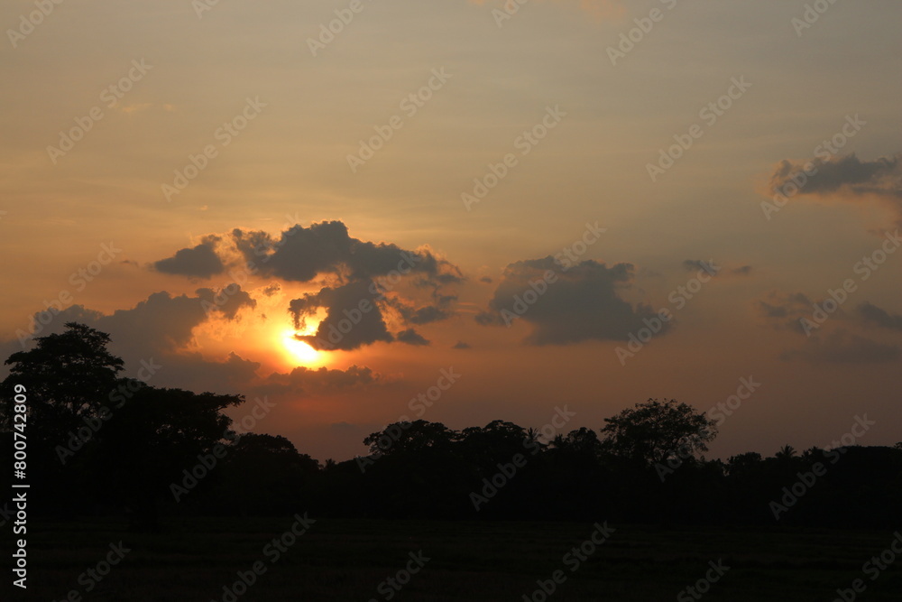 Beautiful colorful dramatic sky with clouds at sunset or sunrise.