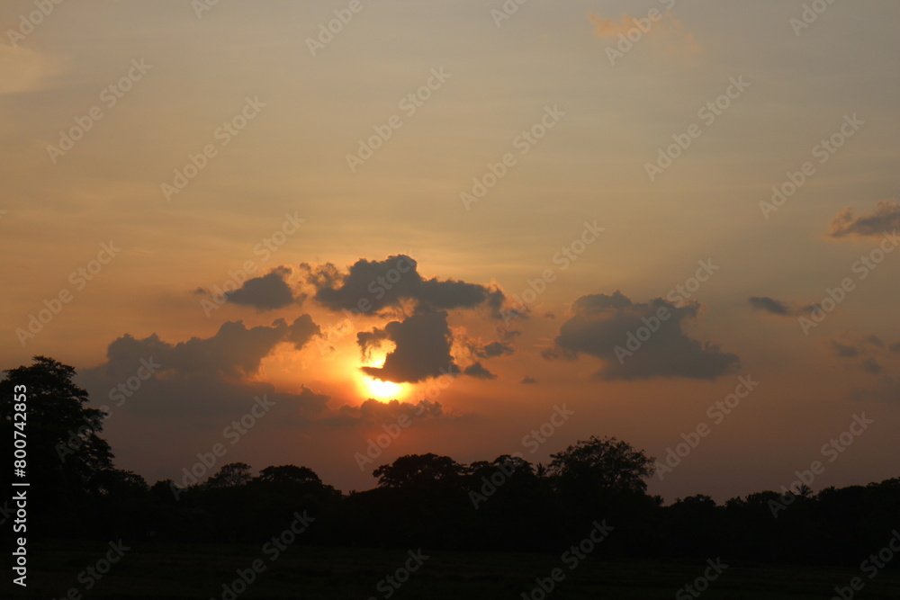 Beautiful colorful dramatic sky with clouds at sunset or sunrise.