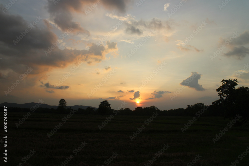 Beautiful colorful dramatic sky with clouds at sunset or sunrise.