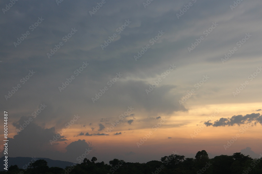 Beautiful Vivid sky painted by the sun leaving bright golden shades. Image of cloud sky on evening time. Evening Vivid sky with clouds. Beautiful Vivid sky painted by the sun leaving bright golden shades. Image of cloud sky on evening time. Evening Vivid sky with clouds.