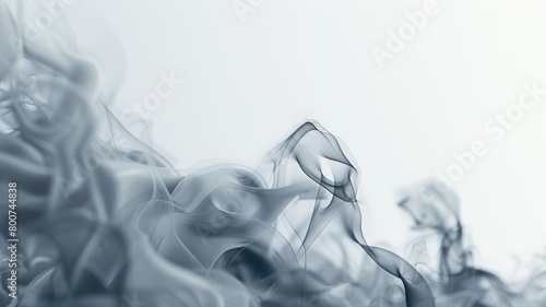 Abstract image of ethereal blue smoke swirls on lighter background