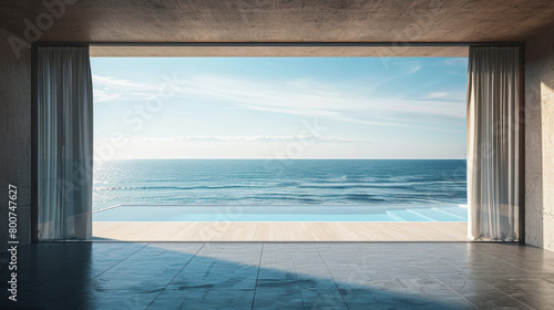 A large open window overlooking the ocean. The curtains are drawn, and the room is empty. Scene is serene and peaceful, as the view of the ocean is the main focus photo