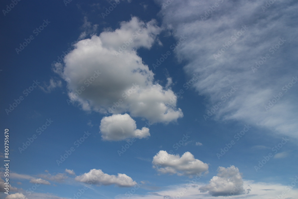 Fototapeta premium Blue sky with white clouds. Blue background. The summer sky is colorful clearing day and beautiful nature in the morning. for backdrop decorative and wallpaper design. The perfect sky background.