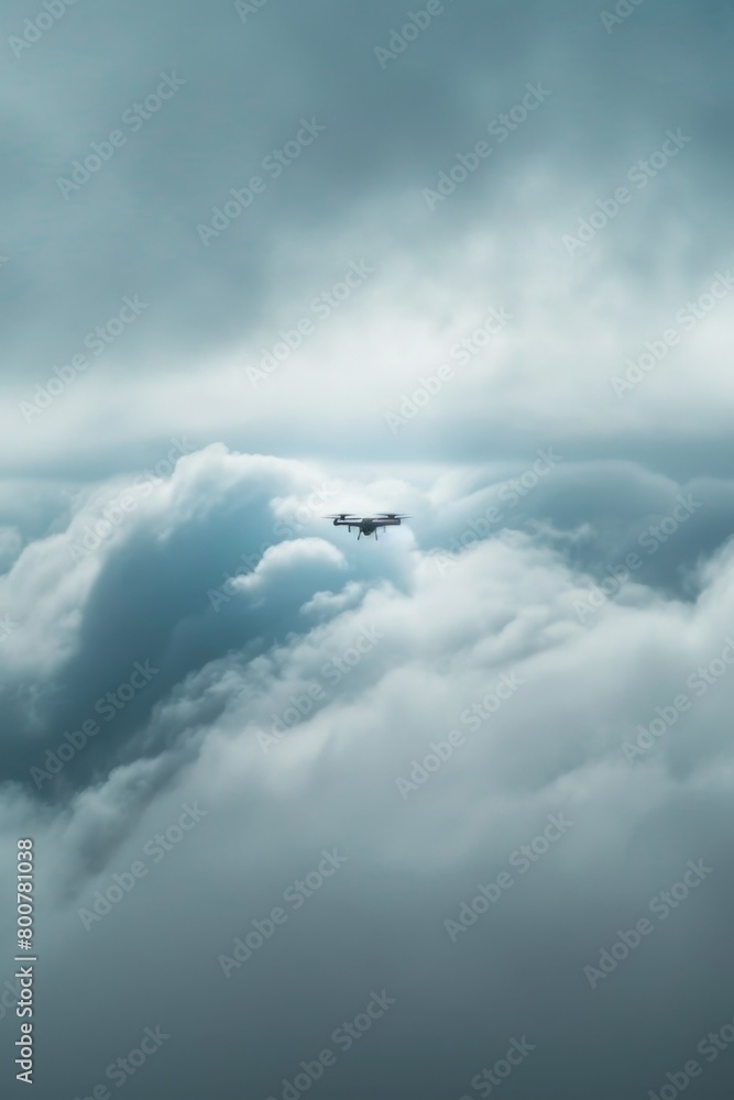 Fototapeta premium A MALE drone disappearing into a thick layer of clouds, symbolizing the unseen eye in the sky
