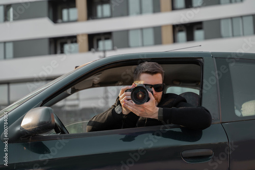 Special agent undercover, taking photos from the car