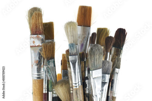 Array of paintbrushes of different sizes and colors over white
