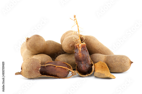 Tamarind whole and cracked open on white background