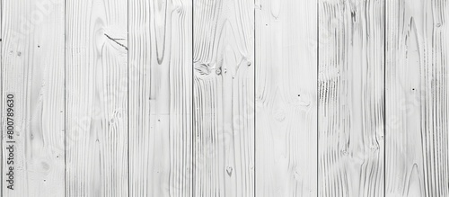 A close up of a white wooden wall showcasing a black and white picture, adding a classic touch to the interior decor photo