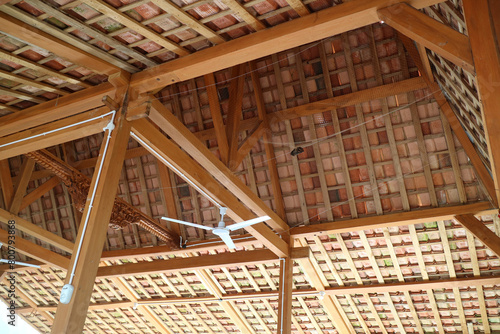 The roof of a simple building  the frame is made of wood. Roof tiles are made from clay