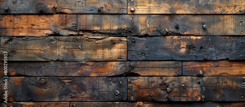 Weathered wooden wall with visible rust and nails protruding, showing signs of age and decay