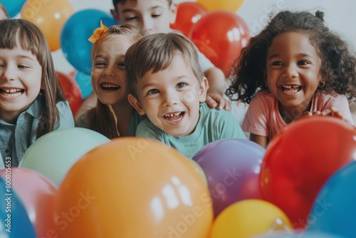 children playing together with colorful balloons