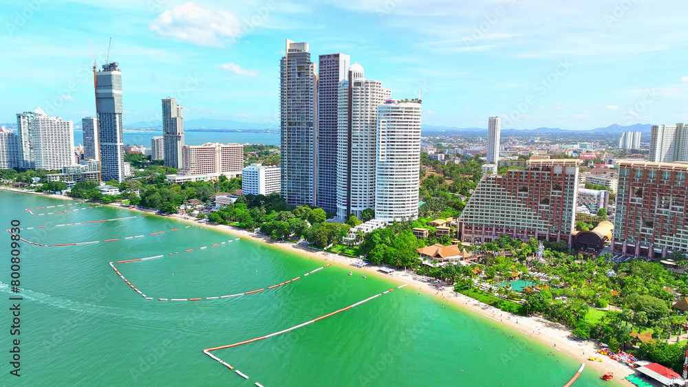 Naklejka premium The beach is an iconic destination, a paradise for marine enthusiasts. A lively shoreline filled with diverse hotels, delectable restaurants, and charming souvenir shops. Pattaya Beach, Thailand. 