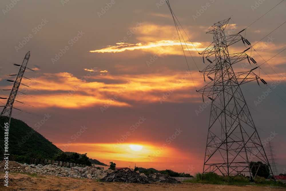 High voltage pole electric wiring distribution landscape energy engineering. Electricity energetic background with blue sky green mountain in countryside. Electric power energy engineering industrial