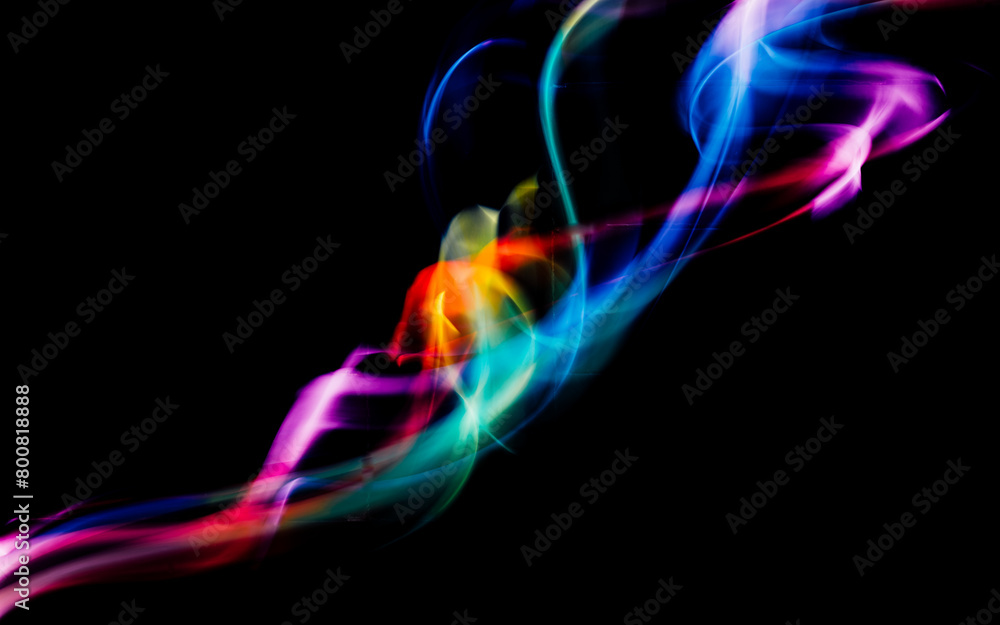 Obraz premium Abstract colorful irregular lines background. Long exposure. Light painting photography.