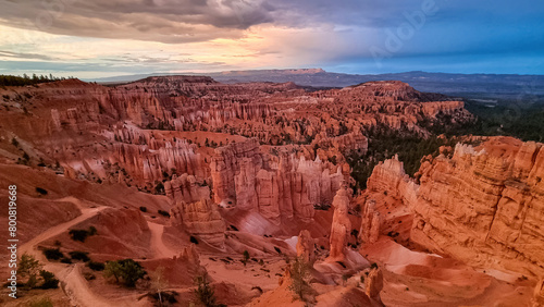 Aerial sunrise view of impressive hoodoo sandstone rock formations in Bryce Canyon National Park, Utah, USA. First morning sun rays touching on natural unique amphitheatre sculpted from red rocks © Chris