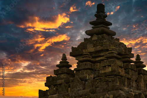 Dramatic evening sky covering old temple of Plaosan in Yogyakarta, Indonesia
