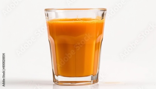 Carrot juice in a glass captured on a white background