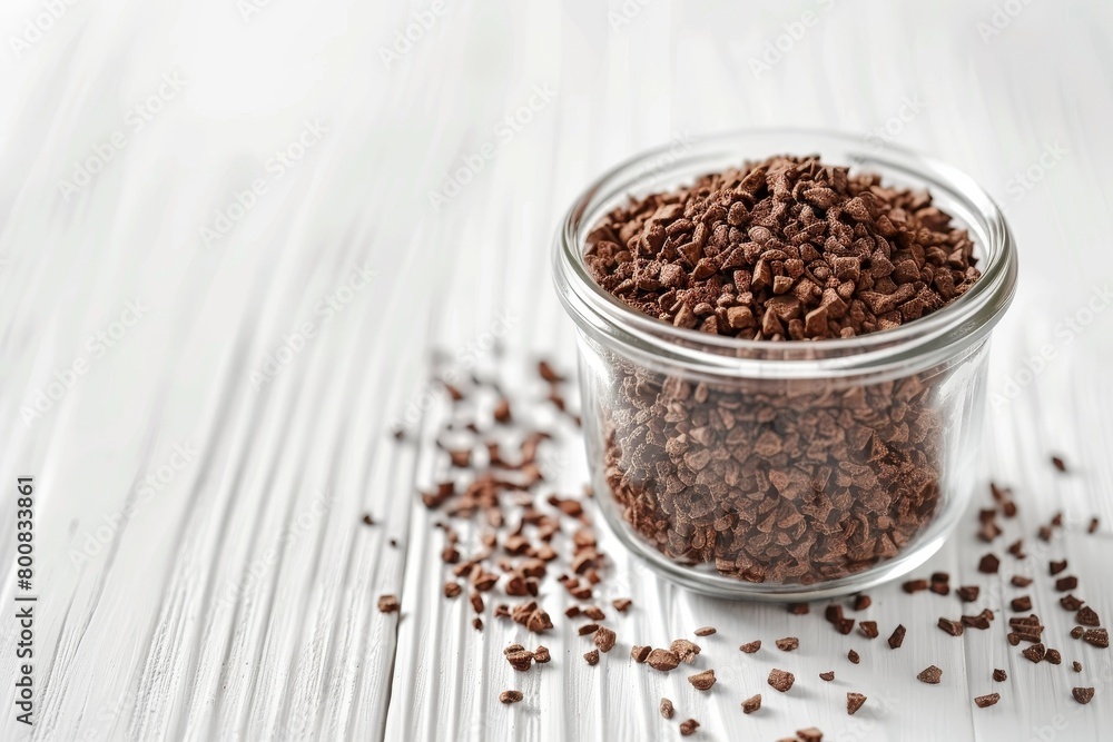 Chicory granules in jar on white table closeup Room for text Chicory granules in jar on white table closeup Room for text