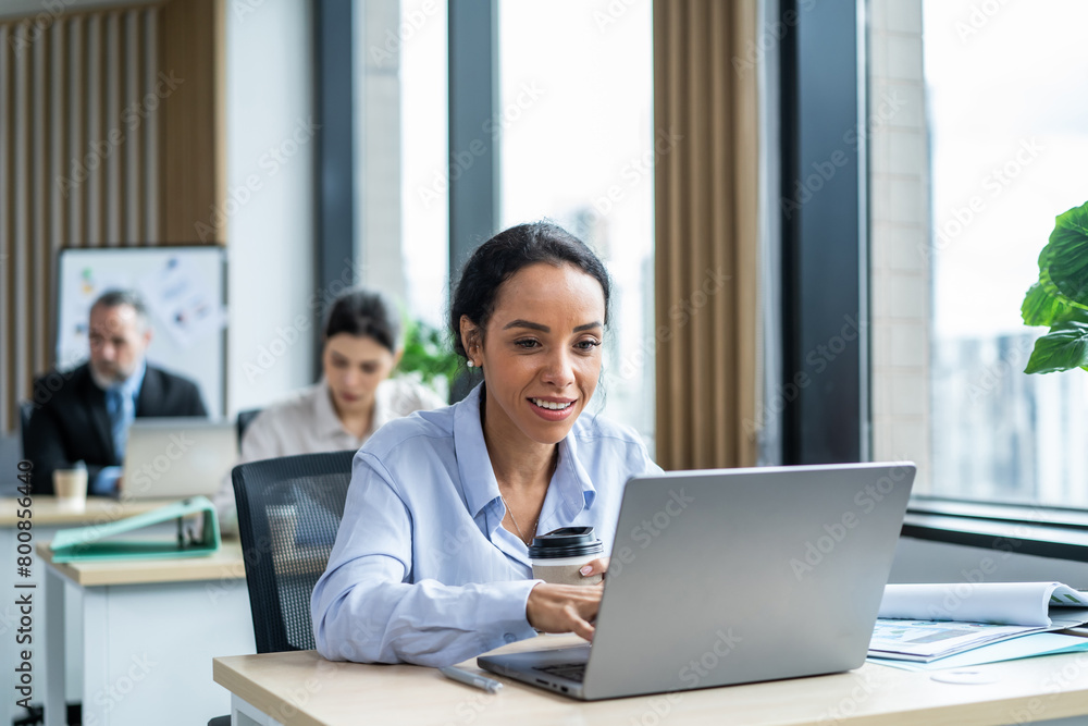 Latino beautiful businesswoman using laptop computer working in office. Latino beautiful businesswoman using laptop computer working in office.