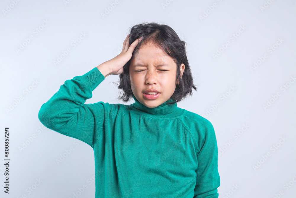 Little Girl Touching Head Having Headache and Problems Isolated on Gray Background Little Girl Touching Head Having Headache and Problems Isolated on Gray Background