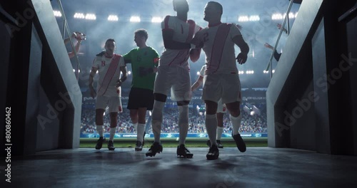 Soccer Stadium Tunnel: Group of Athletic European Football Players Exiting the Field After a Championship Match. Excited Crowd of Spectators Cheering for Their Favorite Football Club photo