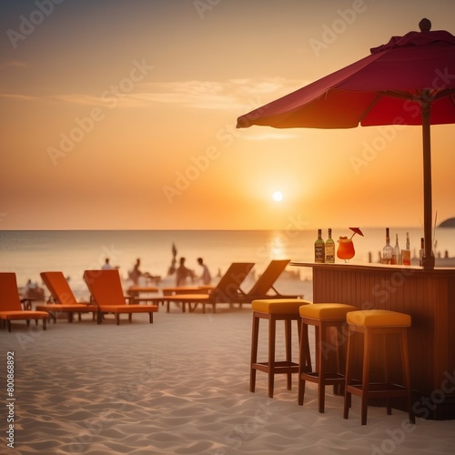 sunset on the beach with cocktail bar and sun loungers