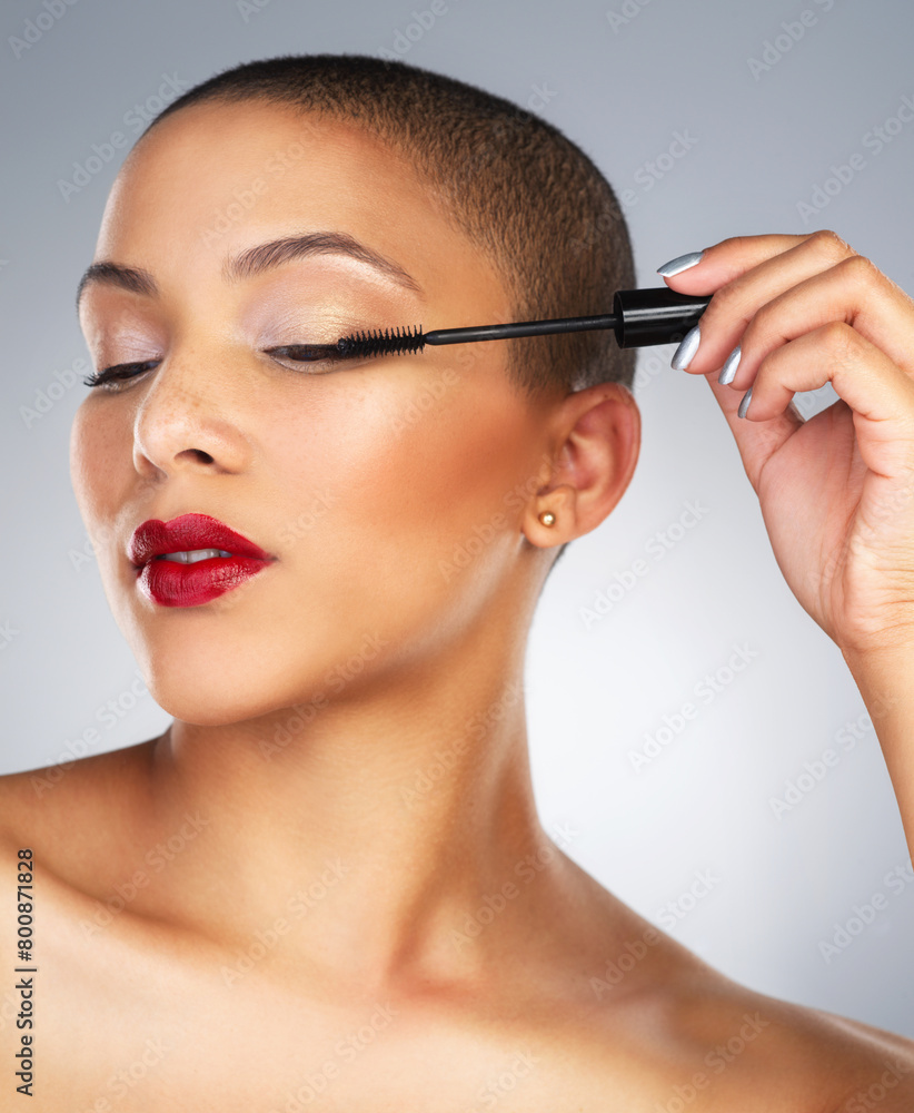 Cosmetics, eyelash and woman with mascara in studio, beauty and makeup application with pride. Face, female model and tool for aesthetic with volume, lashes product and self care by white background