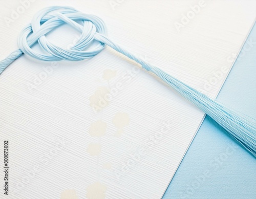 Mizuhiki paper strings that are tied around a wrapped gift Japanese style image