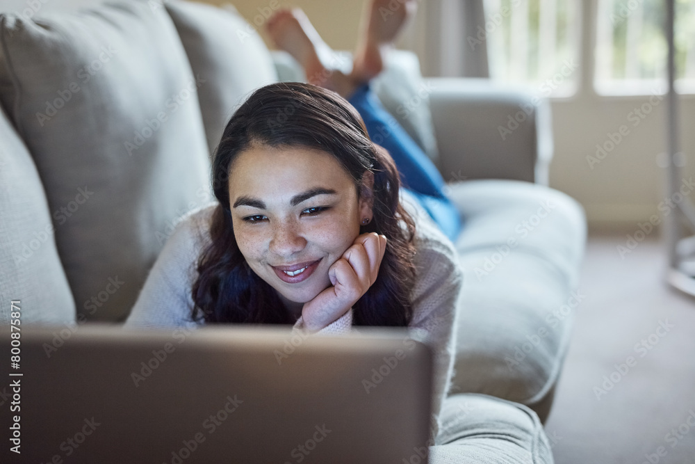 Sofa, relax and woman in home on laptop, smile and streaming for video or movie. Online, subscription and technology with internet for happy female person, computer and couch in living room house Sofa, relax and woman in home on laptop, smile and streaming for video or movie. Online, subscription and technology with internet for happy female person, computer and couch in living room house