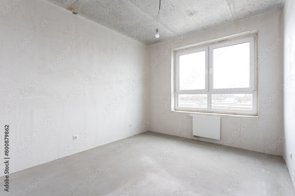 Fototapeta premium interior of the apartment without decoration in gray colors. rough finish