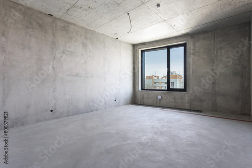 interior of the apartment without decoration in gray colors. rough finish