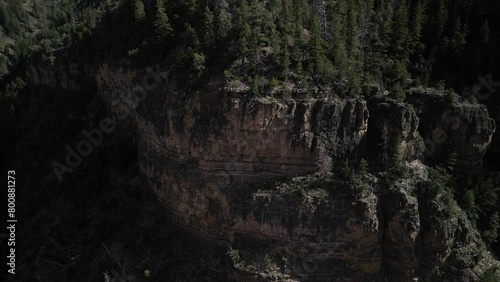 Aerial of rocky cliffs in Glenwood Canyon Colorado reveal highway and river photo