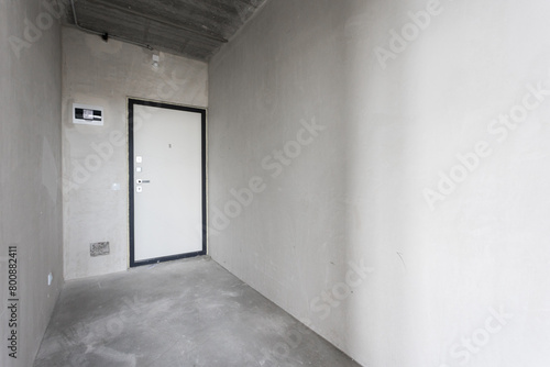 interior of the apartment without decoration in gray colors. rough finish