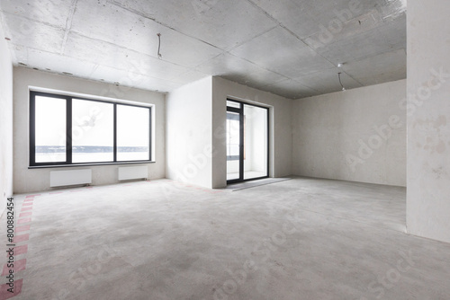 interior of the apartment without decoration in gray colors. rough finish