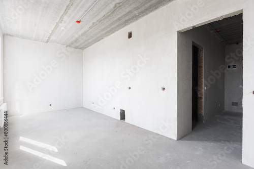 interior of the apartment without decoration in gray colors. rough finish