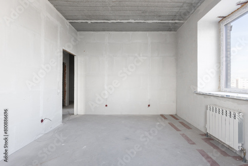 interior of the apartment without decoration in gray colors. rough finish