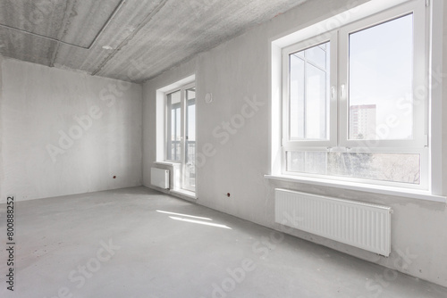 interior of the apartment without decoration in gray colors. rough finish