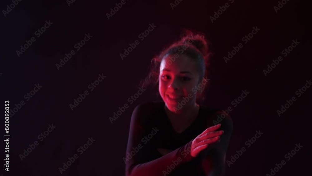 A Lady Dances Under The Red Glow Of Studio Lights A Lady Dances Under The Red Glow Of Studio Lights