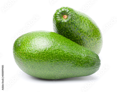 Two ripe ettinger avocados with vibrant green skin, isolated on a white background. Real photo © Jacek Fulawka