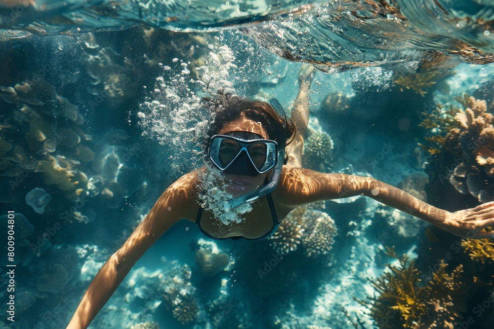 Naklejka premium Snorkeling amongst colorful coral reefs.