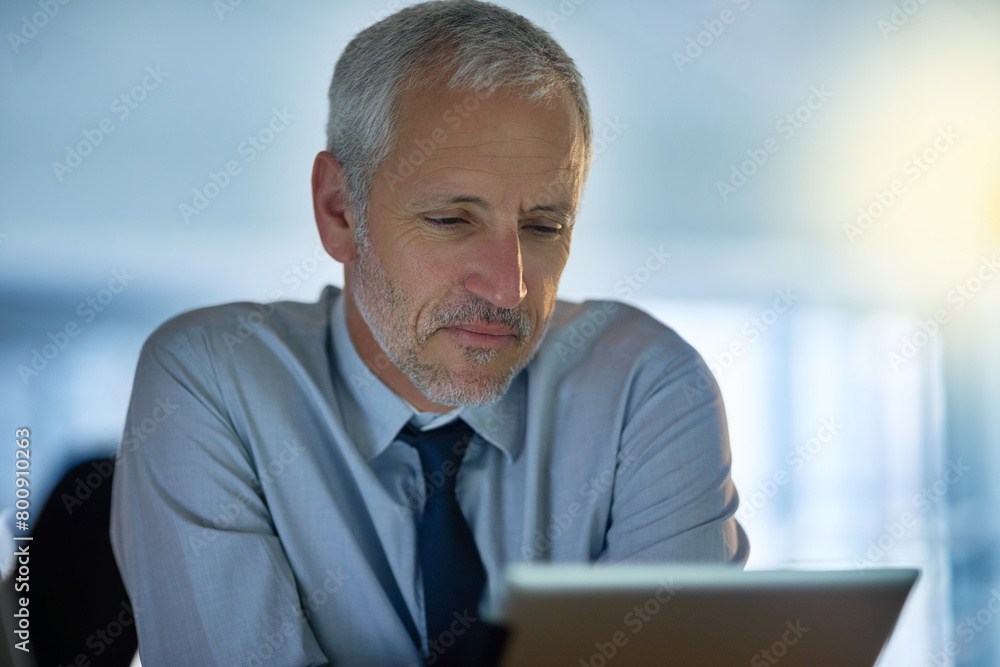 Fototapeta premium Business, mature and man with tablet in office by desk as director for research or information on project growth. Formal, male boss and digital technology on website for ideas of company development
