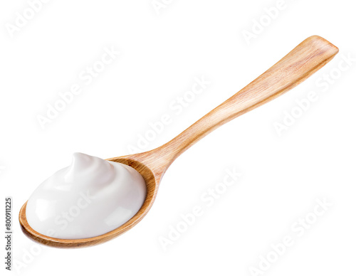 cream sour in wooden spoon isolated white background. Reference for design.