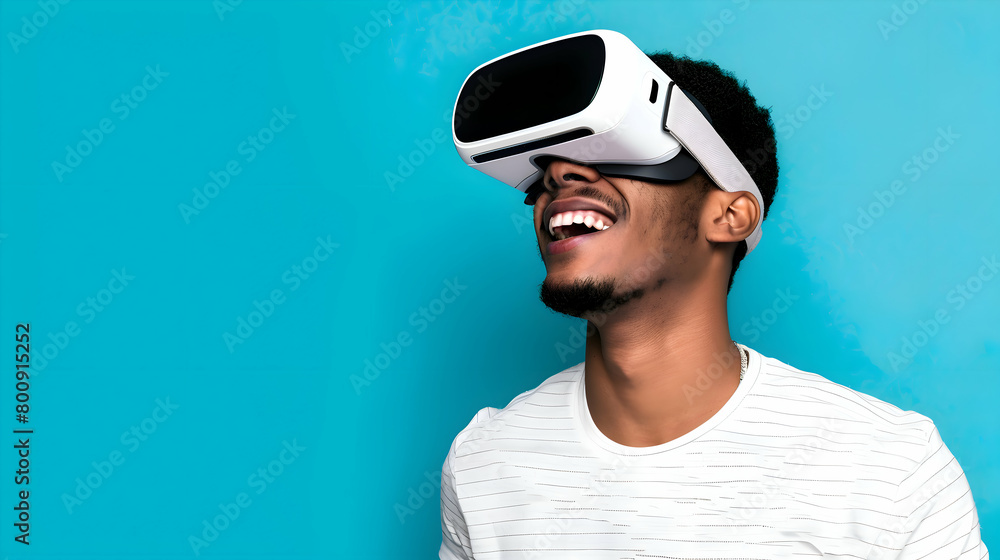 Young black man wearing virtual reality (VR) goggles. Light background. Space for copy. Young black man wearing virtual reality (VR) goggles. Light background. Space for copy.