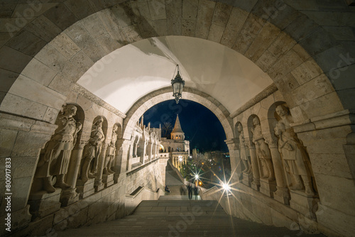 View on the Old Fisherman Bastion in Budapest. Arch Gallery. Popular tourist attraction in Hungary. Arpad-era warrior statues guarding the stairs at Fishermans Bastion.