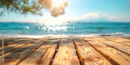 Empty wooden table top with blurred beach background for product display, vacation and travel concept. summer banner template.