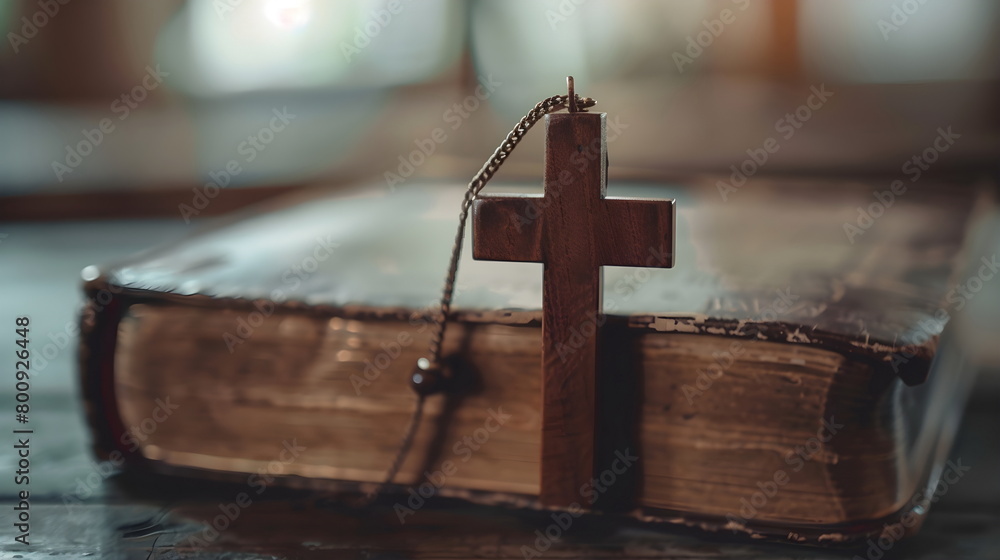 Closeup of a wooden cross on an open Bible