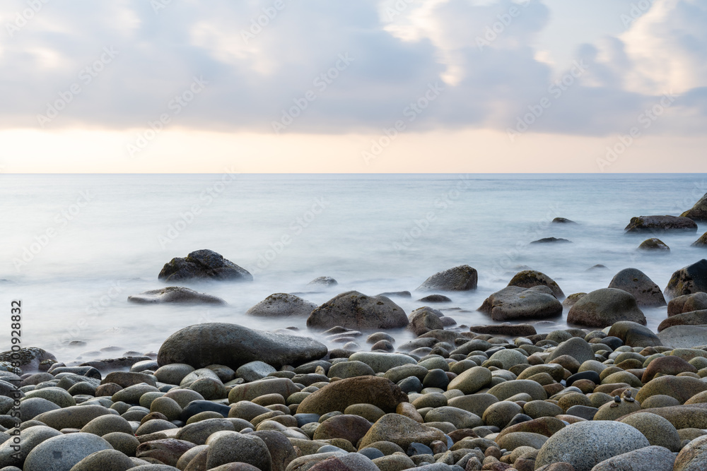 Close-up of pebble beach. Long exposure shots. Close-up of pebble beach. Long exposure shots.